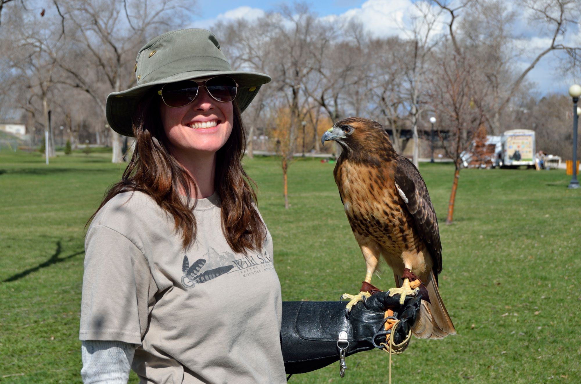 Brooke Tanner holding Vesper Red Tailed Hawk picture by  Jesse Lee Varnado